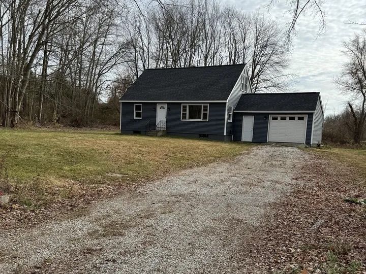 Renovated Cape-style home on Mack Road in Lebanon, CT with detached garage