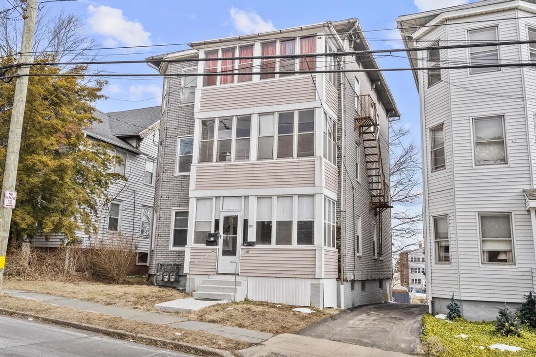 Side elevation of the New Britain, CT triplex showing all three floors of the multi-family building