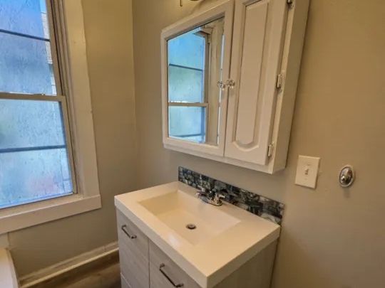 Second bathroom with new vanity and medicine cabinet in the Norwich, CT two-family