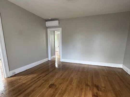 Living space with wall-mounted mini-split providing permanent heat and cooling to the unit